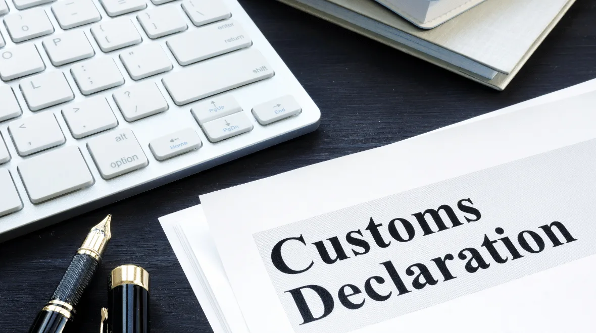 Customs declaration form in Chinese with printed fields and official stamps, illustrating the export clearance process.