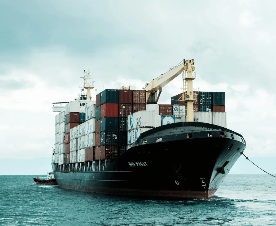 Full Container Load (FCL) freight shipment with large cargo containers at a port