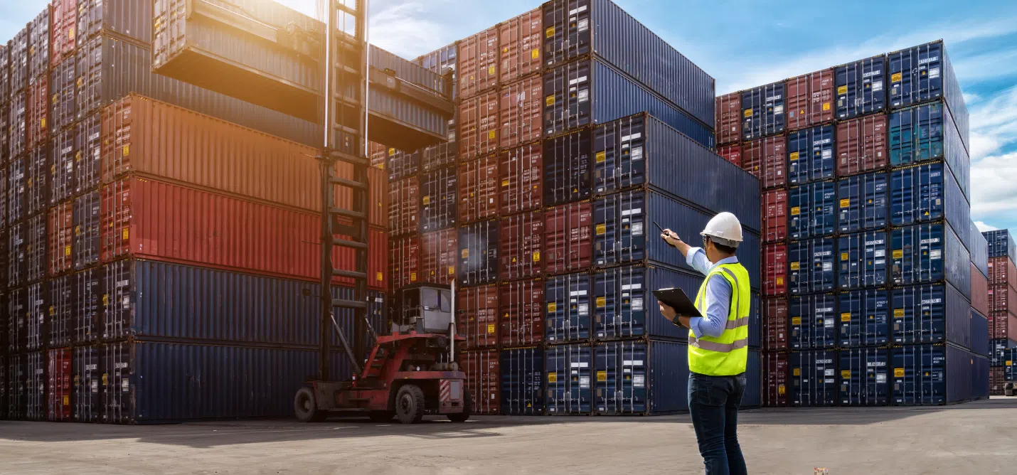 Warehouse with crates and cargo containers, global map overlay showing shipping routes from China